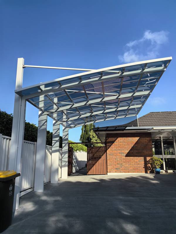 A white aluminum frame carport, protecting vehicles from sun exposure in Auckland, offers durable and sleek design.
