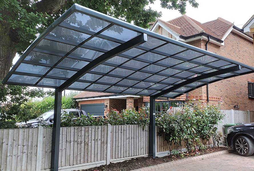 Homelovers' stylish charcoal aluminum freestanding carport, offering flexible protection and enhanced outdoor appeal.